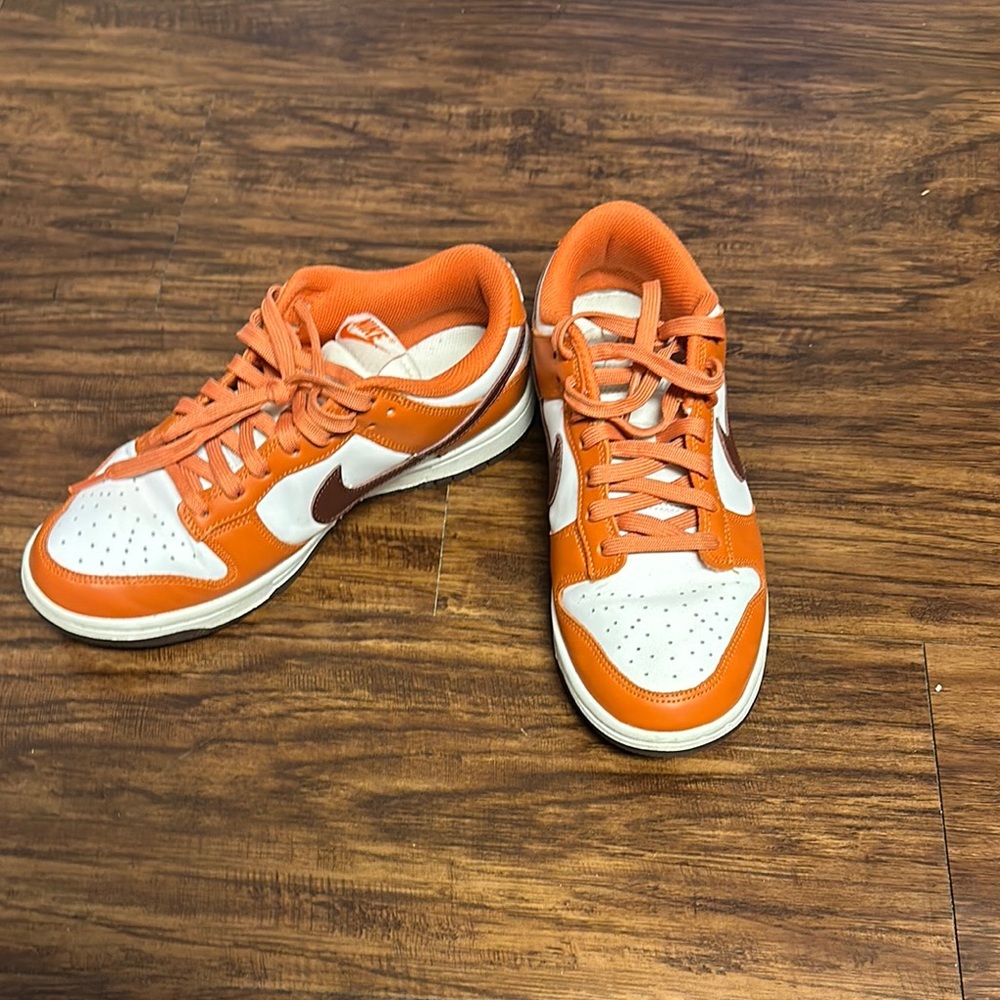 Orange and white Nike dunks